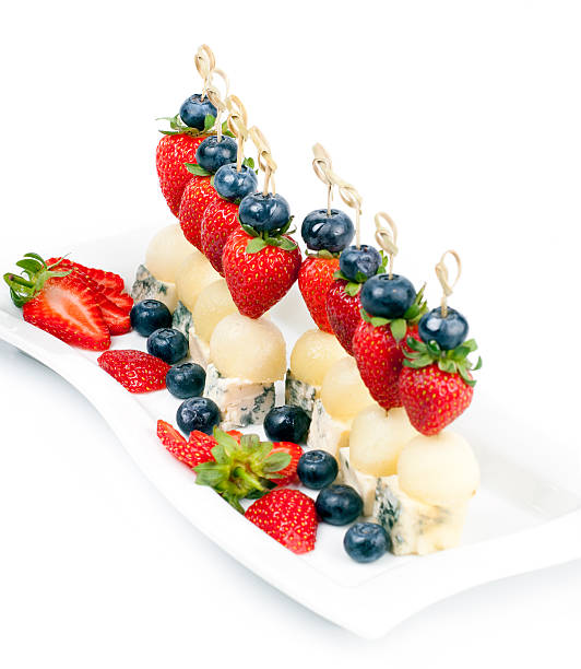 istock Canapes on a plate with cheese melon and strawberries 176488321