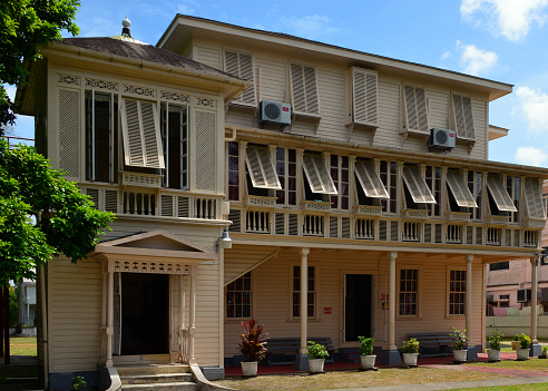 Georgetown, Demerara-Mahaica, Guyana: Walter Roth Museum of Anthropology - housed on a late 19th century three-storey colonial timber structure designed by British Guiana architect, Mr. John Bradshaw Sharples - façade with both Demerara windows and unsightly air conditioning units, Main Street, North Cummingsburg.