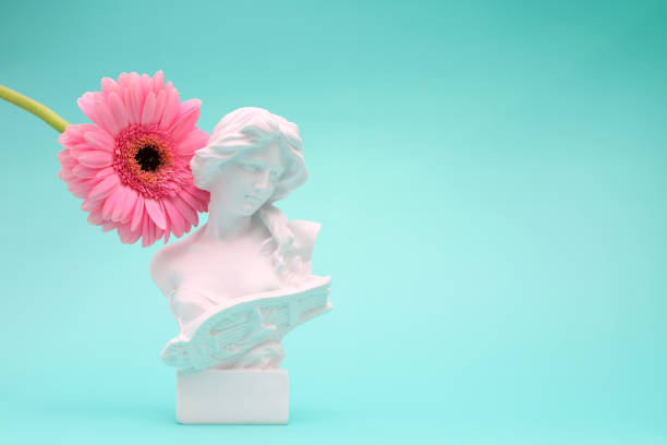 istock Female bust sculpure greek style with gerbera flower on blue background 1764901981
