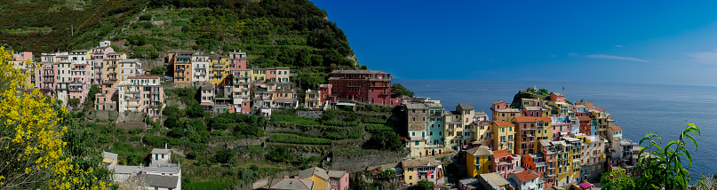 Panoramic view on the cliff town of Manarola, one of the colorful Cinque Terre in Luguria, Italy overlooking the sea