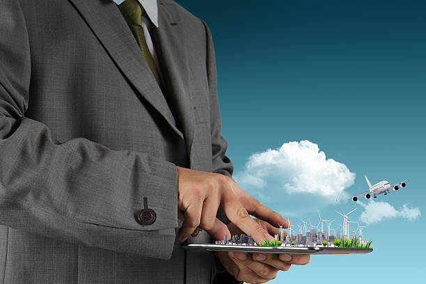 istock businessman hand holds touch pad 176491133
