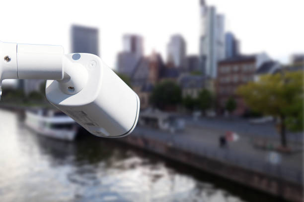 istock CCTV Camera Operating with city in background. 1764927671