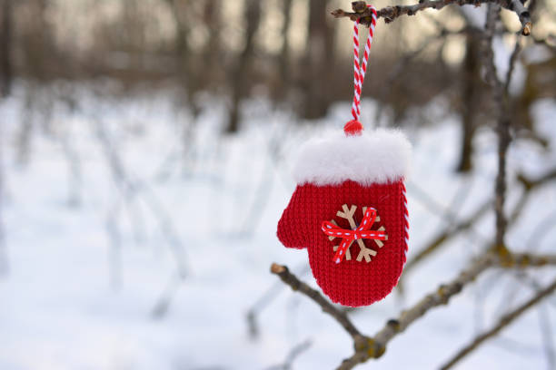 istock red mittan hanging on the twig in the snowy forest copy space 1764941301