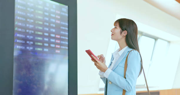 istock businesswoman check mobile fly time 1764944105
