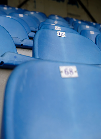 Empty blue seats in a football stadium