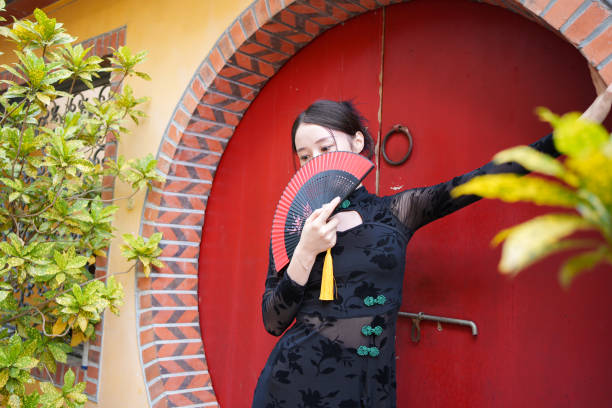istock Classical woman covering her face with fan 1764970310