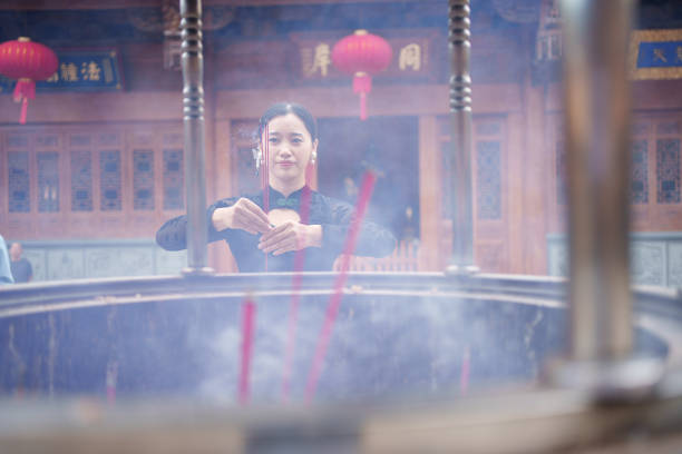Asian woman praying