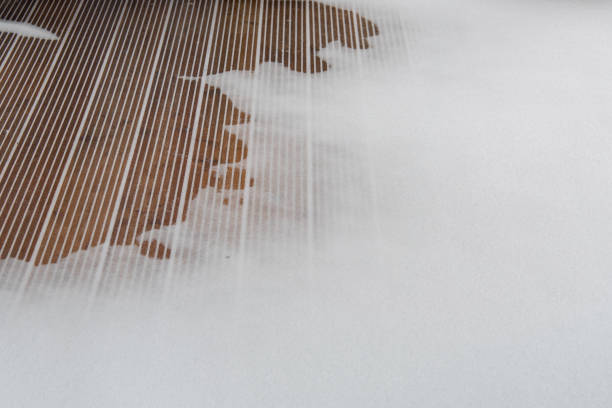Snowdrift on a terrace with a wooden floor