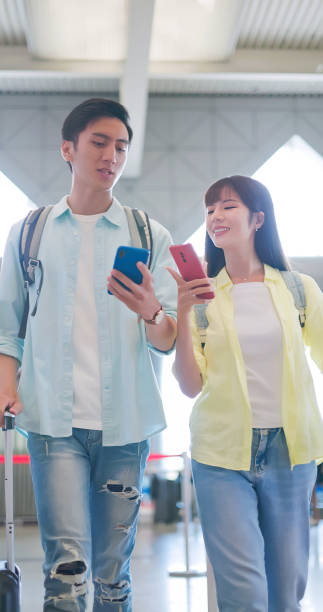 istock Couple happily chat at airport 1764989821