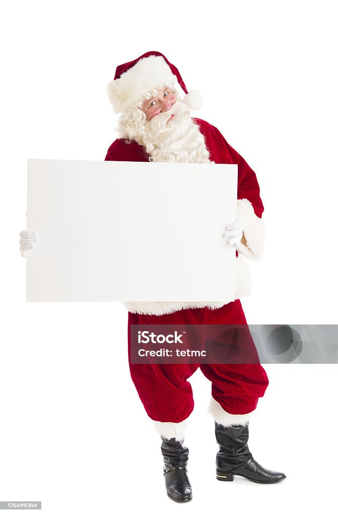 Portrait Of Santa Claus Holding Blank Billboard Full length portrait of Santa Claus holding blank billboard while standing isolated over white background Full Length Stock Photo