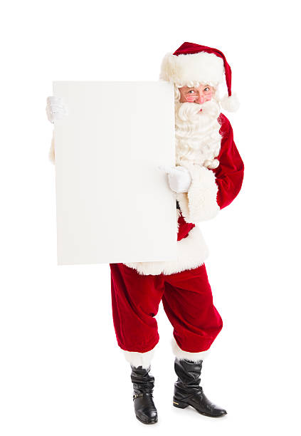 istock Santa Claus Pointing At Blank Billboard 176499351
