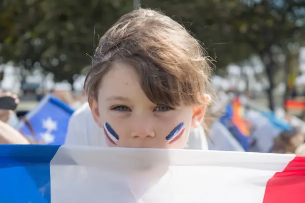 Pretty young girl supporting the French team in a sports tournament