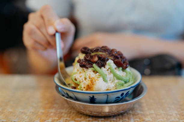 Young asian woman enjoying cendol in restaurant