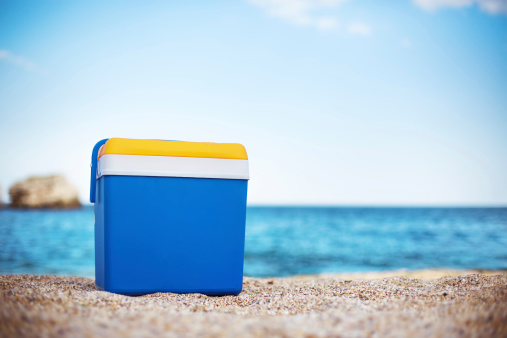 Blue cooler box on the beach
