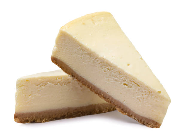 istock Two pieces of cheesecake close-up on a white background. 1765029524