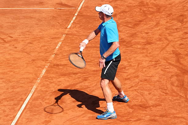 istock tennisplayer in Action on clay court 176503121