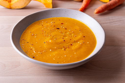 Pumpkin and carrot cream soup. Autumn dish suitable for lunch and dinner.