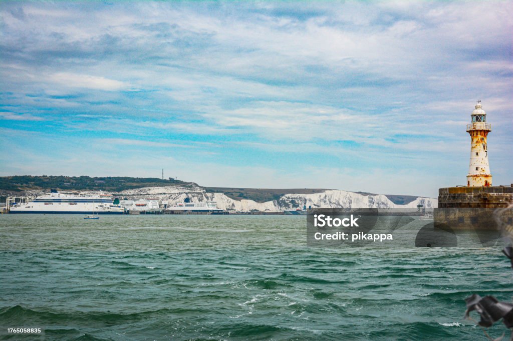 White Cliffs of Dover view from the sea, Dover, Kent, England, UK White Cliffs and the harbor of Dover view from the sea, Dover, Kent, England, UK Architecture Stock Photo