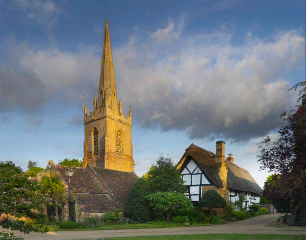 istock Church and thatched cottage at Lower Quinton, Warwickshire, England 1765072653