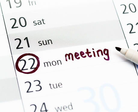 Note in felt-tip pen reminds you about a meeting.