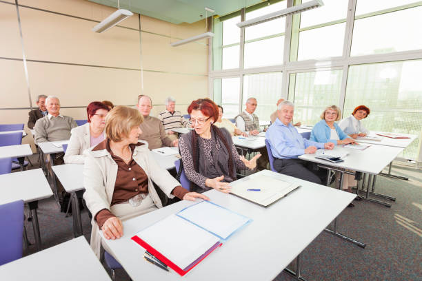 Group of 14 happy seniors on motivation seminar. Model and Property released.