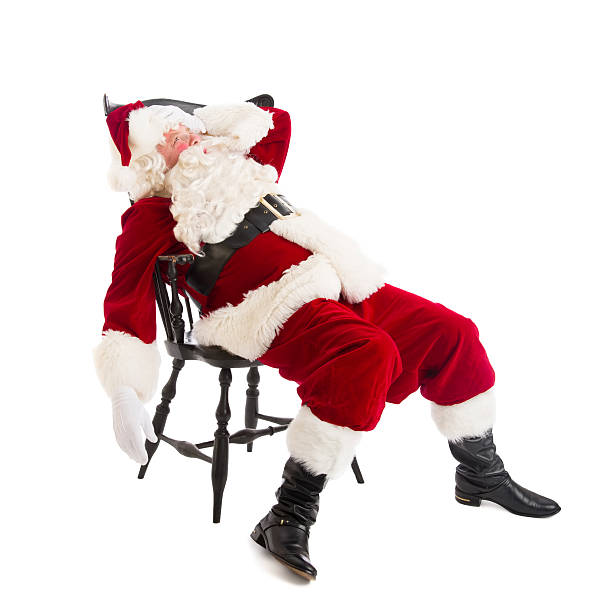 istock Tired Santa Claus Sitting On Chair 176516107