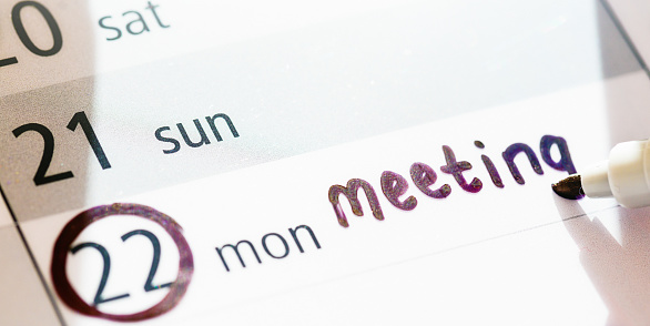 Note in felt-tip pen reminds you about a meeting.
