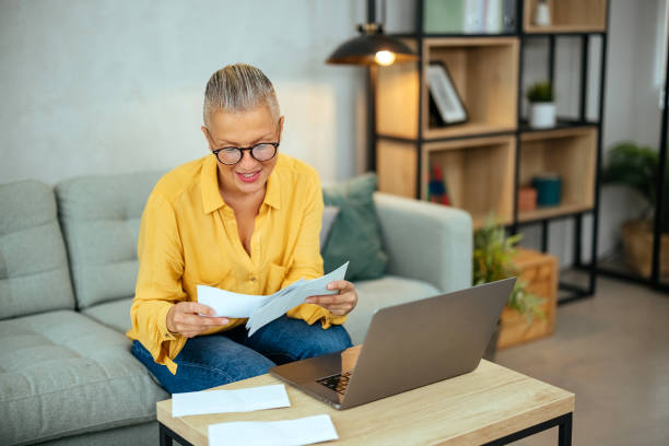 istock Woman analyzing financial budget at home 1765191093