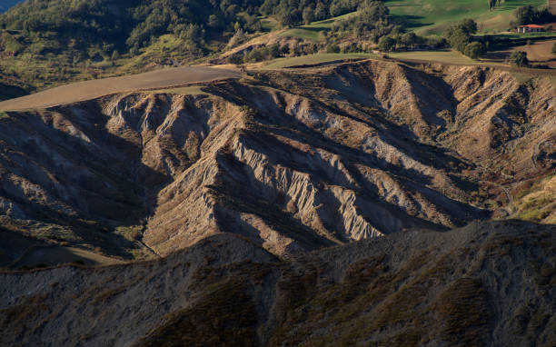 istock view of field and badlands hills 1765204591