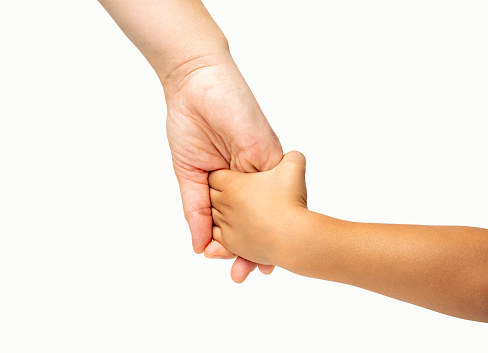 Close up a mother giving a hand to her child isolated on white background