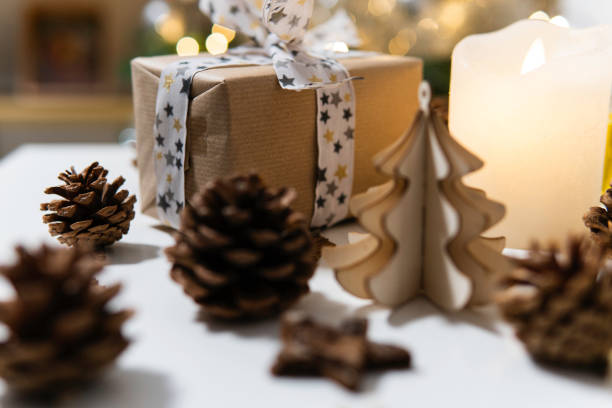 istock Ecologic packaging gift with pinecone and wooden christmas ornaments 1765209096