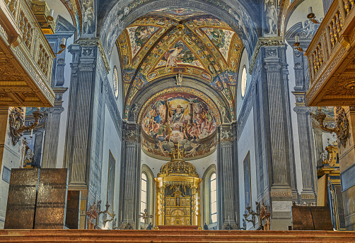 Detail of a church ceiling with beautiful frescoes depicting biblical and religious themes. The photo was taken inside the Basilica of Santa Maria Maggiore in Bergamo, Italy.