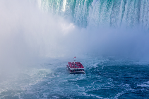 Close-up of a tour boat getting very close to the Horseshoe falls, Niagara Falls, Canada