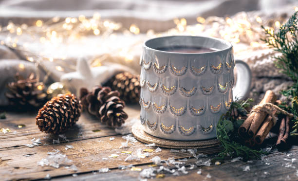 istock Coffee cup at home on a wooden table with bumps on a background with decorations 1765221689