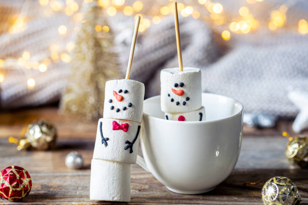 istock Hot chocolate mug and a snowmen made of marshmallows. 1765222944