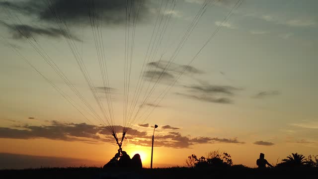 Paragliding at sunset.