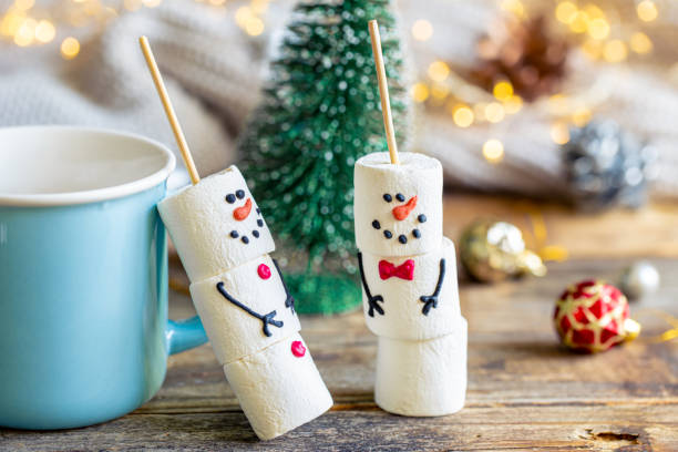 istock Hot chocolate mug and a snowmen made of marshmallows. 1765222969