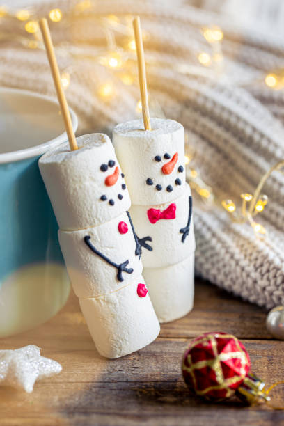 istock Hot chocolate mug and a snowmen made of marshmallows. 1765222982
