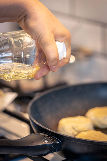 istock Cheesecakes are flying on a pan close-up, cheese pancakes. 1765227751