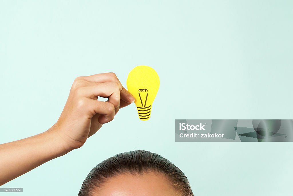 Woman thinking concept with hand holding light bulb Woman thinking concept Adult Stock Photo