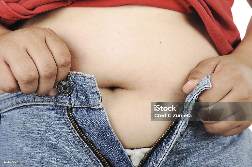 Chubby kid trying to wear pants Zipper Stock Photo