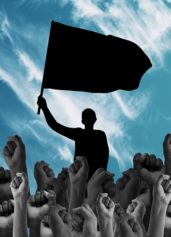 Hands, fist and freedom, human rights activism and flag with silhouette of person, graphic or illustration for equality. Political movement, feminism or empowerment with rally, protest and solidarity