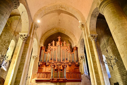 Macro close up depicting different knobs and controls of a church organ inside an old English Anglican church.