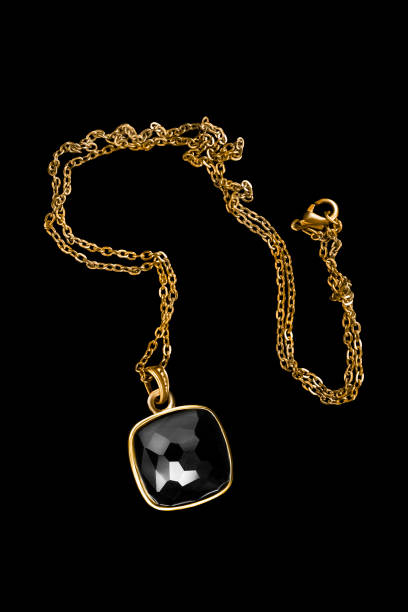 istock Golden necklace on black 1765234918