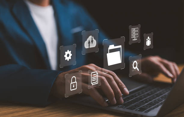 istock Document Management System DMS, Businessman with Online Document Database and automated icons processes in file management Search and manage document database files online,store, manage. 1765237826
