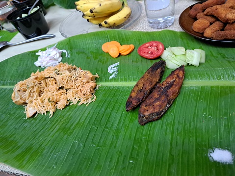 Fish fry and biryani on a banana leaf in Chennai, Tamil Nadu