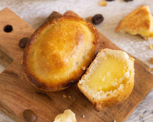 istock Pasticciotto leccese pastry filled with egg custard cream on a wood close up 1765240784