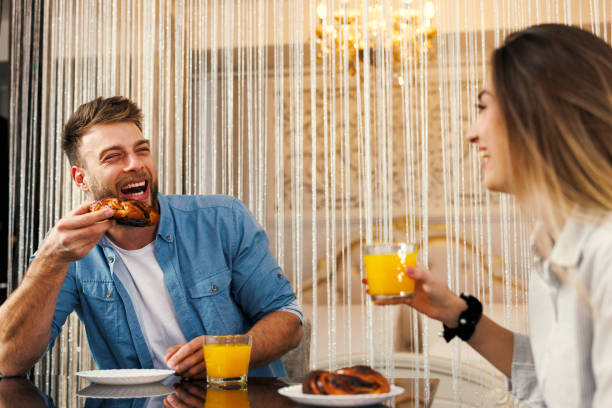 istock Young happy couple having breakfast at home 1765251625