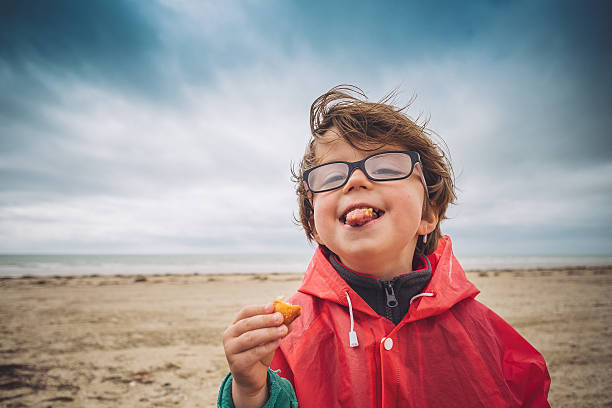 Wide-angle picture of a child under a cloudy sky