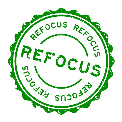 Grunge green refocus word round rubber seal stamp on white background